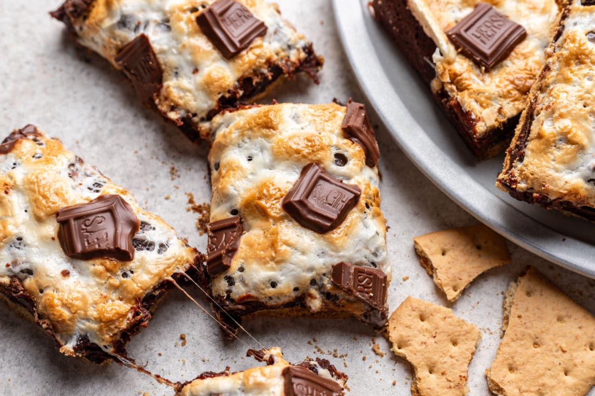 S'mores brownies next to a platter of s'mores brownies. 