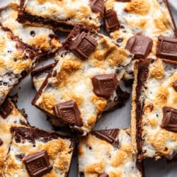 Overlapping s'mores brownies on a plate.