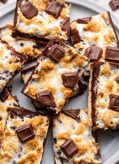 Overlapping s'mores brownies on a plate.