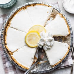 A frozen lemonade pie with a slice removed.