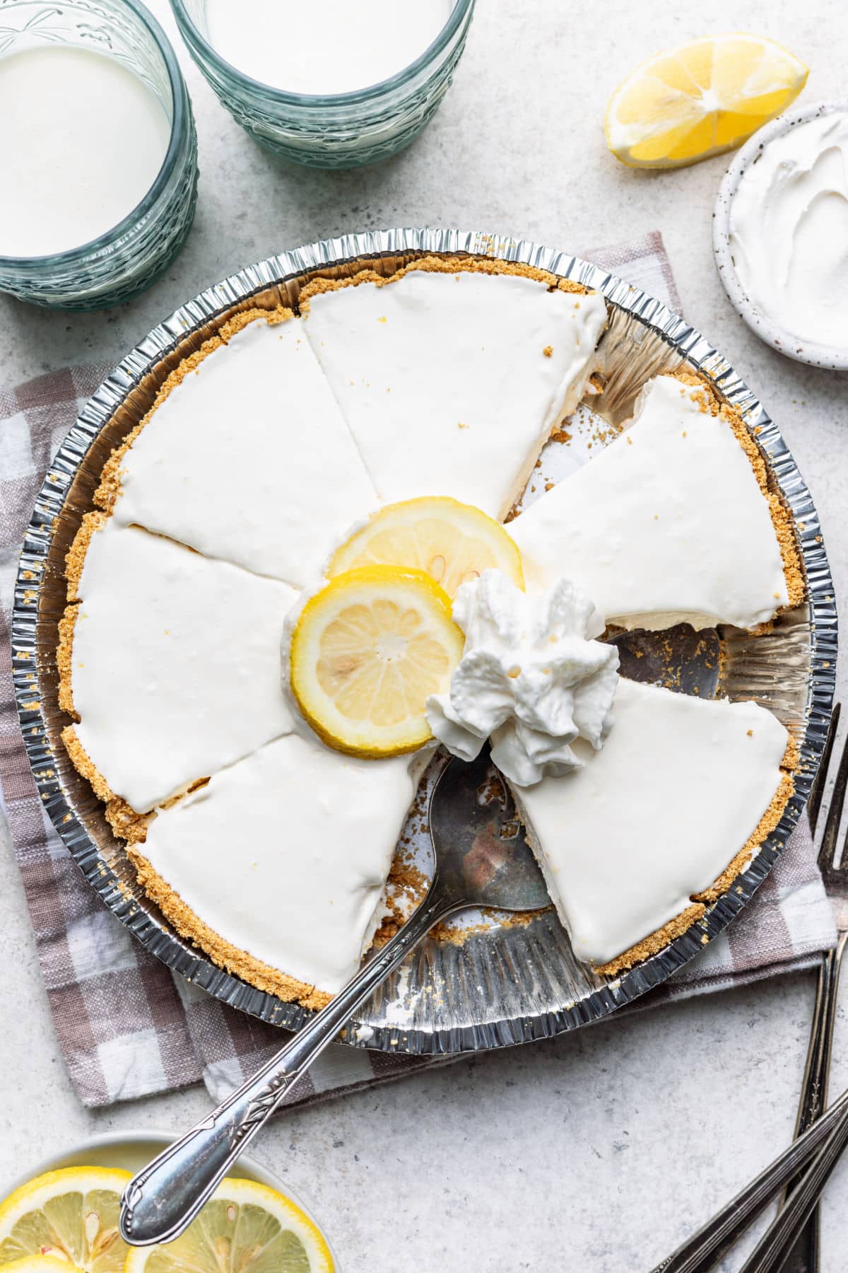 A frozen lemonade pie with a slice removed.