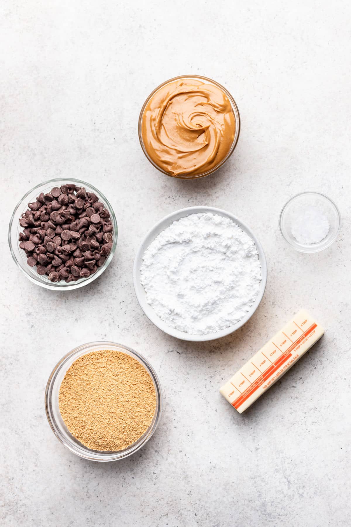 Ingredients for no bake peanut butter bars in dishes.