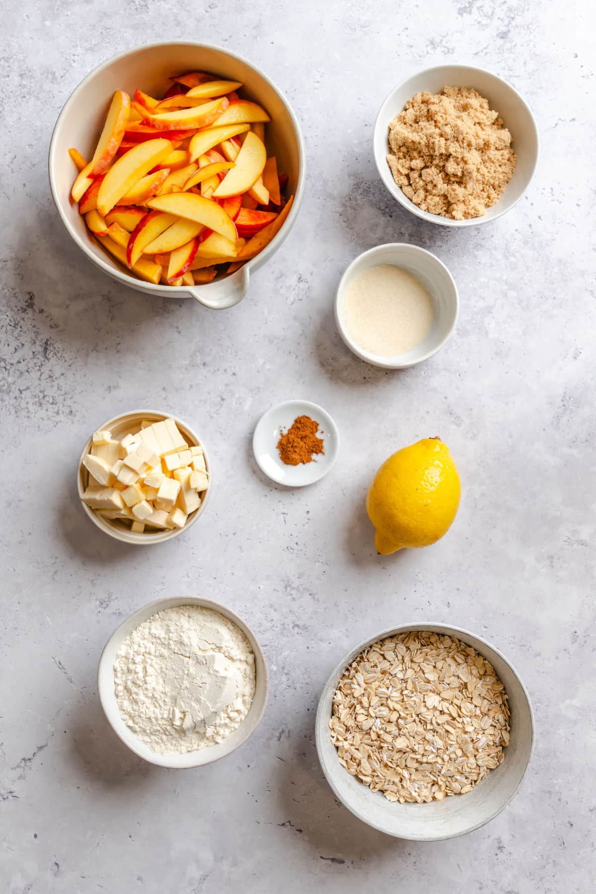 Ingredients for peach crisp in dishes.