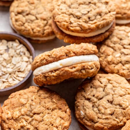 One homemade oatmeal cream pie on its side on top of other oatmeal cream pies.