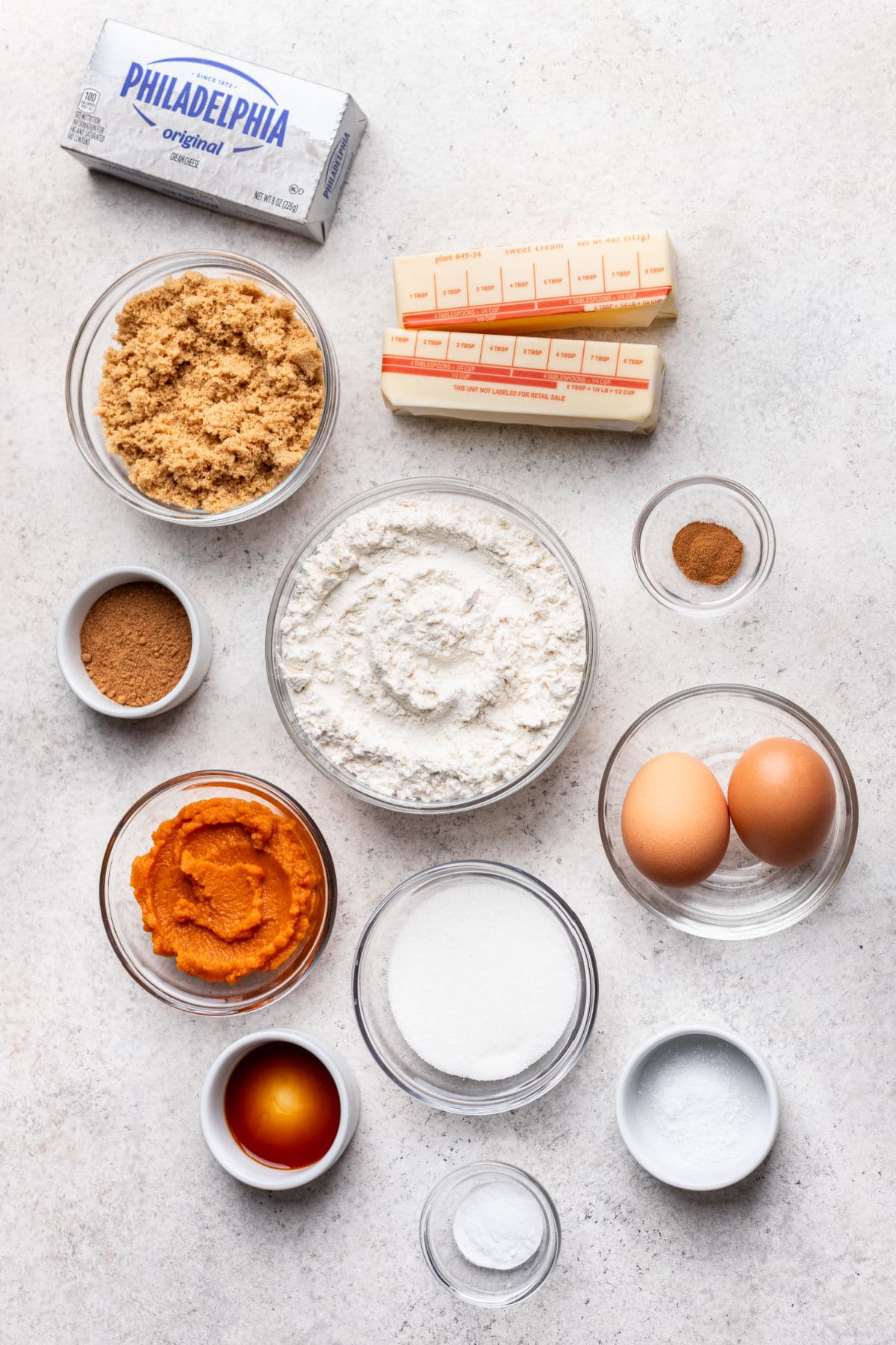 Ingredients for pumpkin cheesecake cookies in dishes.