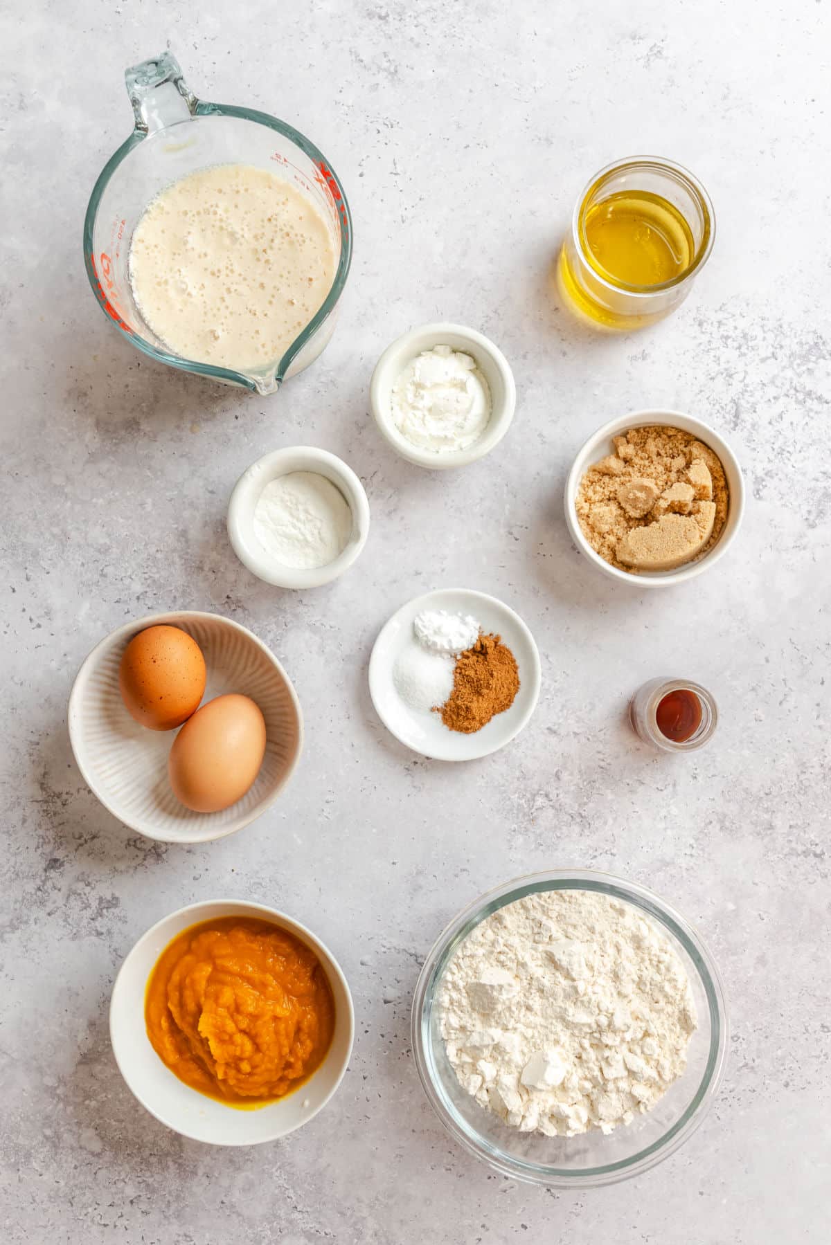 Ingredients for pumpkin waffles in dishes.