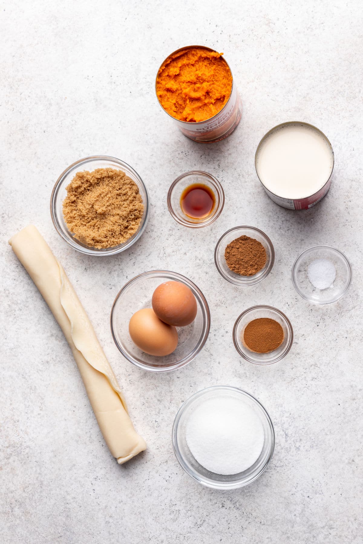 Ingredients for mini pumpkin pies in dishes.